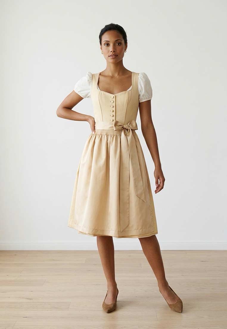 Krüger Dirndl Miralys gelb 70cm im Frontansicht. Das stilvolle Dirndl hat einen hellgelben Rock und eine passende Schürze.