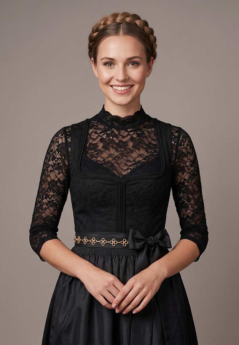 Frontansicht einer stilvollen schwarzen Alpenflüstern Dirndl Schürzenkette mit Blumenmuster und goldfarbenen Elementen.
